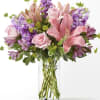 Beautiful pinks and lavender and a clear vase with mixed screens