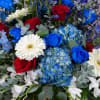 This sympathy altar arrangement, in the colors red, white, and blue, is