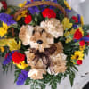 A Brown Pup with designer choice flowers in a brown basket. Just