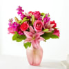 This refreshing bouquet is full of berry colored signature stems making it