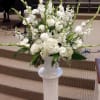 An assortment of beautiful white flowers, such as gladiolus, stock, lisianthus. roses