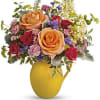 our on the sunshine! Filled with radiant roses, this cheerful yellow pitcher