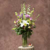 A collection of seasonal flowers in ivory lavender and white
that will bring