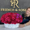 Over 100 roses in a vase with orchids.  Incredible vase; no