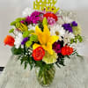 Arrangement of mixed flowers. Colorful and cheerful, includes &quot;happy birthday&quot; pick. Please