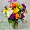 Arrangement of mixed flowers. Colorful and cheerful, includes &quot;happy birthday&quot; pick. Please