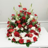 This arrangement surrounds the urn of your loved one with roses, snapdragons