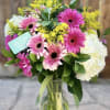 This playful arrangement is bursting with joy! Radiates happiness and is sure