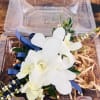 Wrist corsage and boutonniere including orchid and accents. CUSTOMER CAN CHOOSE ANY