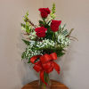 These red roses and snaps are the perfect arrangement to send to