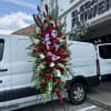 A standings flower arrangement for a funeral service is a heartfelt tribute