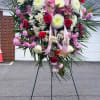 We design a big and beautiful pink and white spray with a