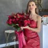 This bright bouquet includes a variety of red roses in rich tones