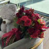 This bright bouquet includes a variety of red roses in rich tones