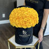 A black signature box with yellow roses&mdash;a rare combination&mdash;makes this box unique