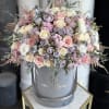 A stunning all-around arrangement of fine flowers in our signature grey box