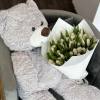 A stunning arrangement of 50 white tulips will enhance any occasion.
