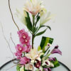 Great flower arrangement consisting of lilies, cymbidium, spray roses, mini calla lilies