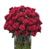 Stunning arrangement of 100 roses in a classic cylinder vase