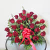 Amazing flower arrangement of 24 red roses in a single sided basket

Similar