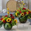This Unique Design includes red roses, sunflowers, dianthus green trick, wheat, crespedia