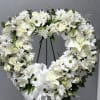 Honor a life beautifully lived with our Open Heart Standing Wreath. Designed