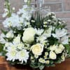 An elegant display of faith and divine peace, this beautiful arrangement will