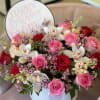 A combination of red and pink roses with beautiful cymbidium orchids. Please