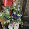 Bright and beautiful silk blooms on a Grapevine wreath. A welcome sight