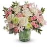 This arrangement features cr&egrave;me roses, pink spray roses, pink alstroemeria, pink carnations