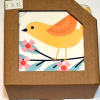 These colorful birds perch on pretty branches. A perfect gift for yourself