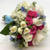 A mix of mostly white flowers with pops of hot pink and