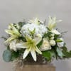 A elegant cubed vase with all white flowers. 
Perfect for any occasion.