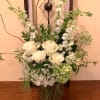 A mixed fresh cut consisting of White Roses, White and Mini Green