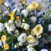 The vibrant colors in the casket spray pay tribute to the vibrant