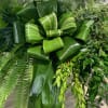 An All Foliage Casket Spray featuring a variety of different greeneries for