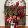 Tropical red and gold arrangement tall and modern in ceramic white vase