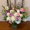 A mixed fresh cut consisting of White Roses, Cream Butterfly Ranunculus, Light