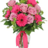 a combination of purple roses and hot pink gerbera.  Subject to
