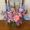 A mixed fresh cut consisting of one Pink David Austin Garden Rose