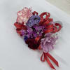 Pink, purple and red corsage 
