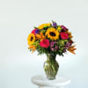 Bold, bright, and bursting with life&mdash;this tall, show-stopping arrangement features golden sunflowers