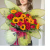 This cheerful butterfly-shaped bouquet features a delightful blend of 12 sunflowers and
