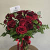 This Romantic Flower Arrangement contains: 9 red roses, 7 red carnations, mini