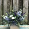 Textured whites, blues and silvery greens gathered in a modern container create