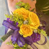 Yellow roses , purple ribbon , greens rhinestones 