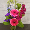 Colors of sapphire, ruby and amethyst warm the heart. Flowers include Ruby