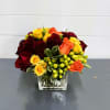 A jumble of roses in red yellow and orange create a carousel