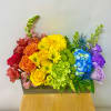 This Pride Arrangement includes Rainbow Colored Flowers in a Wooden Box. 
Flowers