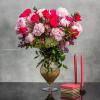 Elevate your surroundings with this opulent floral arrangement that marries the finest